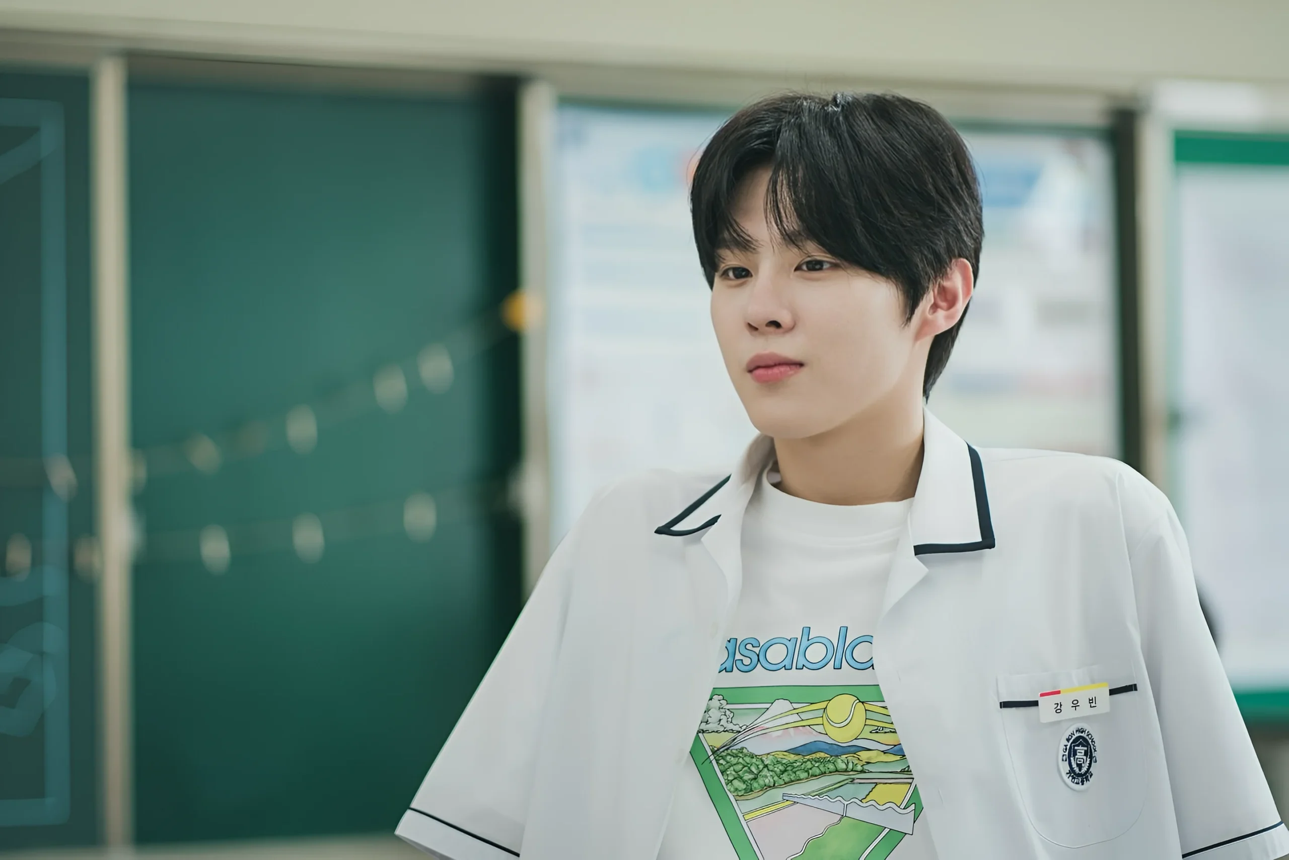 Kim Woo-seok while weaing school shirt on top of a T-shirt
