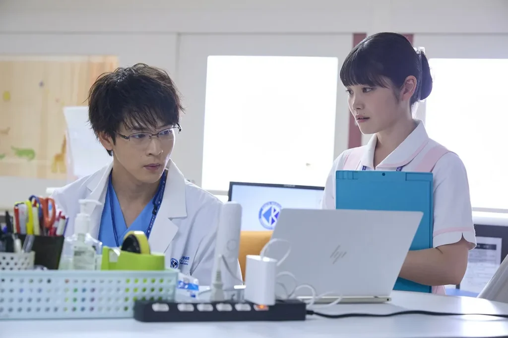 Makino reviewing Makoto's records.